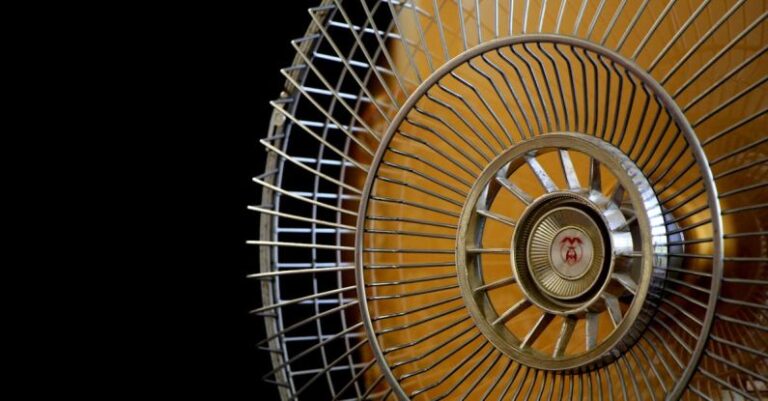 Air Conditioner - Close-up Photography of Gray Stainless Steel Fan Turned on Surrounded by Dark Background